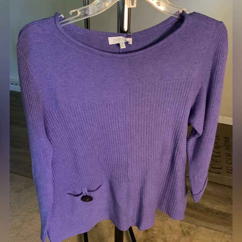 Never worn with tags! Women’s size med. Iris color with 1 front pocket.